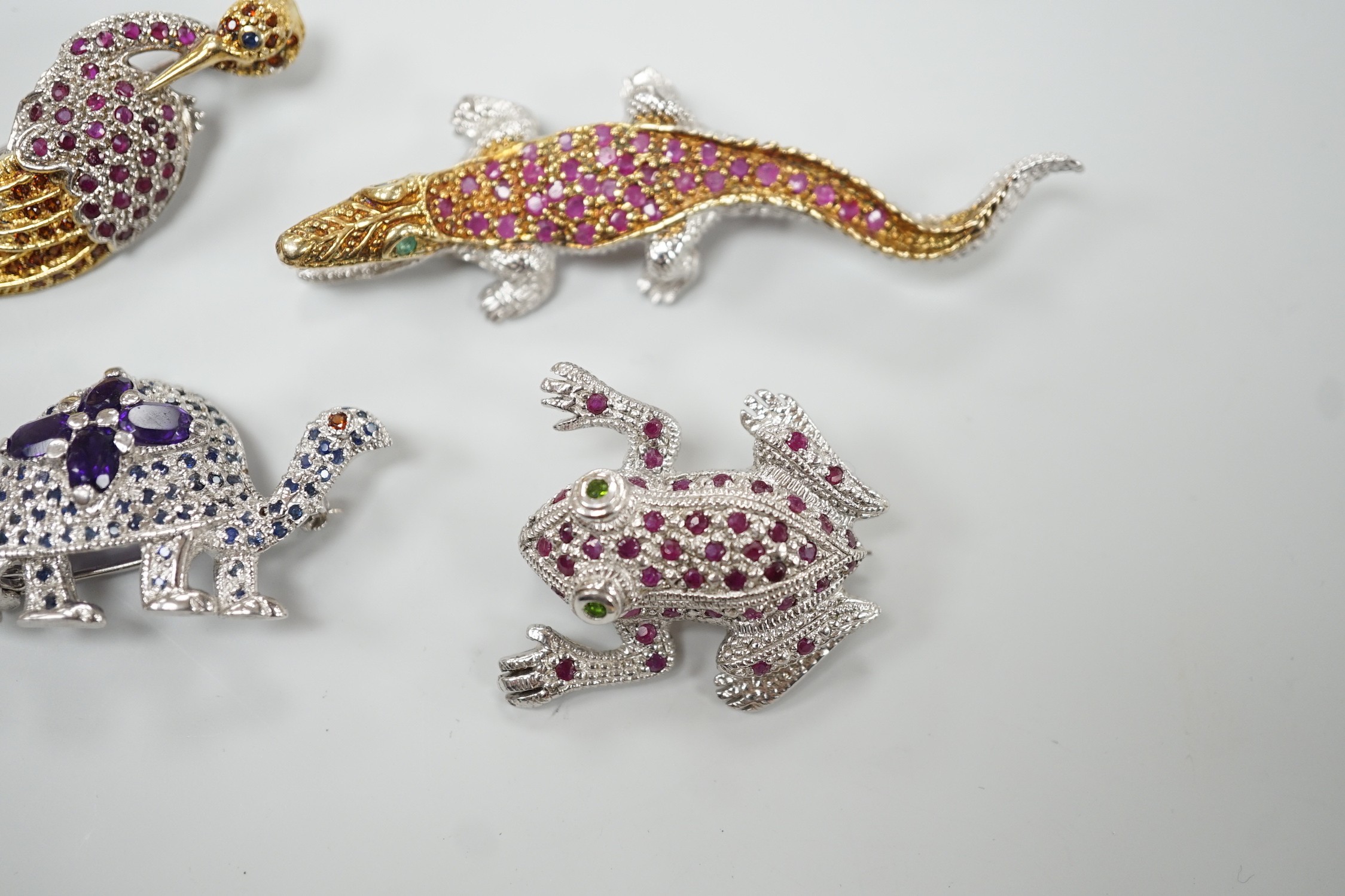 Four assorted modern white metal and coloured paste set miniature animal brooches, three stamped 925, including frog, crane, tortoise and crocodile.